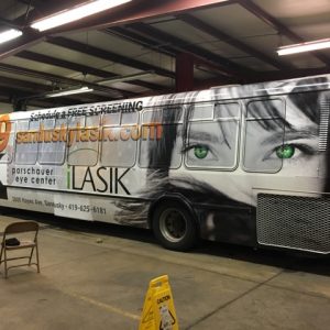 image of city buss with Sandusky Lasik promo image on side